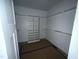 Walk-in closet with custom shelving offers plenty of space for organizing your wardrobe at 60 Stream View Way, Spring Hope, NC 27882
