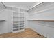Spacious walk-in closet with multiple shelves and rods for ample storage at 60 Stream View Way, Spring Hope, NC 27882