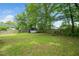 Large backyard with a shed and a wooden fence, offering plenty of room for outdoor enjoyment at 601 Longfellow St, Fuquay Varina, NC 27526