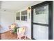 Inviting front porch with seating and charming details at 601 Longfellow St, Fuquay Varina, NC 27526
