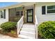 Inviting front porch with white railings and a screen door, leading to the entrance at 601 Longfellow St, Fuquay Varina, NC 27526