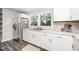 Bright kitchen showcasing stainless steel appliances and a double sink under a window at 601 Longfellow St, Fuquay Varina, NC 27526