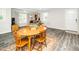 Cozy living and dining area with modern flooring and ample natural light at 601 Longfellow St, Fuquay Varina, NC 27526
