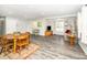 Spacious living area featuring a dining table and a comfortable seating arrangement at 601 Longfellow St, Fuquay Varina, NC 27526