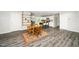 Open-concept living space with kitchen and dining area, featuring modern flooring at 601 Longfellow St, Fuquay Varina, NC 27526
