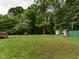 Large backyard with a shed, garage, and ample space at 605 Mace Rd, Mebane, NC 27302
