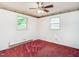 Bright bedroom featuring a ceiling fan and two windows at 605 Mace Rd, Mebane, NC 27302