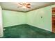 Bedroom featuring green walls, neutral trim and carpet, with a ceiling fan, waiting for the new homeowner's personal touch at 605 Mace Rd, Mebane, NC 27302