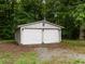 Two-door garage in a wooded setting at 605 Mace Rd, Mebane, NC 27302