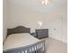 Bedroom featuring a bed, dresser, and a closet with a white door at 672 Millers Mark Ave, Wake Forest, NC 27587