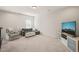 Comfortable bonus room featuring plush carpet and a modern entertainment center at 672 Millers Mark Ave, Wake Forest, NC 27587