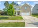 Charming two-story home with a well-manicured lawn and a spacious two-car garage at 672 Millers Mark Ave, Wake Forest, NC 27587