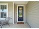 Welcoming front entrance with a glass-paneled door and a cozy 'hello' doormat at 672 Millers Mark Ave, Wake Forest, NC 27587