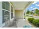 Inviting covered front porch with seating, offering a relaxing outdoor space at 672 Millers Mark Ave, Wake Forest, NC 27587