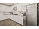 Well-equipped kitchen with stainless steel appliances, granite countertops, and white cabinets offering ample storage at 672 Millers Mark Ave, Wake Forest, NC 27587