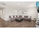 Spacious living room with a fireplace, plush seating, and modern decor at 672 Millers Mark Ave, Wake Forest, NC 27587