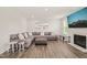 Spacious living room with a fireplace, plush seating, and modern decor at 672 Millers Mark Ave, Wake Forest, NC 27587