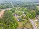 An aerial view of a home showcasing its proximity to nature, trees, and surrounding greenery at 6720 Dwight Rowland Rd, Willow Springs, NC 27592