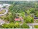 Aerial shot of a home surrounded by mature trees at 6720 Dwight Rowland Rd, Willow Springs, NC 27592
