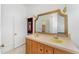 Bathroom featuring a double vanity with a golden framed mirror above, offering a spacious and classic design at 6720 Dwight Rowland Rd, Willow Springs, NC 27592