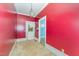 Cozy bedroom with bright red walls, creating a warm and inviting space at 6720 Dwight Rowland Rd, Willow Springs, NC 27592
