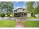 Detached three car garage and carport featuring a brick walkway at 6720 Dwight Rowland Rd, Willow Springs, NC 27592