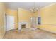 Spacious living room featuring a fireplace and natural light at 6720 Dwight Rowland Rd, Willow Springs, NC 27592