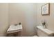 Classic bathroom featuring vintage sink and toilet at 75 Hartwell Cir, Lillington, NC 27546