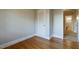 Bedroom featuring wood floors, closet, and easy access to the bathroom at 75 Hartwell Cir, Lillington, NC 27546