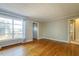 Bright bedroom featuring hardwood floors, neutral walls, and ample natural light at 75 Hartwell Cir, Lillington, NC 27546