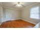 This bedroom is bright with hardwood floors and classic trim and a ceiling fan at 75 Hartwell Cir, Lillington, NC 27546