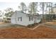 Ranch home featuring an attached garage and a manicured lawn at 75 Hartwell Cir, Lillington, NC 27546