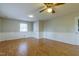 Spacious living room features laminate floors, white trim, and modern ceiling fan with neutral paint at 75 Hartwell Cir, Lillington, NC 27546