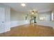 The living room features laminate floors and white trim that flows into the kitchen at 75 Hartwell Cir, Lillington, NC 27546
