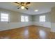 Bright and airy living room featuring laminate flooring, white trim, and natural light from many windows at 75 Hartwell Cir, Lillington, NC 27546