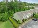 Aerial view of townhomes, mature trees, parking and well-manicured landscaping at 7871 Allscott Way, Raleigh, NC 27612