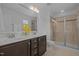 Beautiful bathroom features double sinks, a large mirror, and a glass-enclosed shower at 7871 Allscott Way, Raleigh, NC 27612