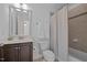 Full bathroom with shower-tub combination, tile flooring and a vanity at 7871 Allscott Way, Raleigh, NC 27612