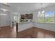 Bright dining room with wood floors, stylish lighting, and ample natural light at 7871 Allscott Way, Raleigh, NC 27612