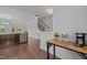 Spacious entryway featuring hardwood floors, staircase, and convenient coffee station setup at 7871 Allscott Way, Raleigh, NC 27612