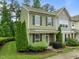 Inviting two-story home with manicured landscaping, lush trees, and charming curb appeal at 7871 Allscott Way, Raleigh, NC 27612