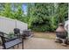 Outdoor patio with green foliage, outdoor furniture and grill at 7871 Allscott Way, Raleigh, NC 27612