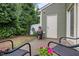 Cozy backyard patio with seating area and outdoor grill, perfect for relaxing and entertaining at 7871 Allscott Way, Raleigh, NC 27612