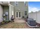 Outdoor patio with green foliage, outdoor furniture and grill, on exterior of house at 7871 Allscott Way, Raleigh, NC 27612