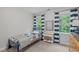 Comfortable bedroom with large windows dressed in blue striped curtains, and coordinating blue bed at 7929 Pine Timber Dr, Raleigh, NC 27613