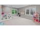 Spacious bonus room with carpet, multiple windows, and plenty of room for activities at 7929 Pine Timber Dr, Raleigh, NC 27613