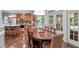 Elegant dining area with hardwood floors, a large table, and a view of the kitchen at 7929 Pine Timber Dr, Raleigh, NC 27613