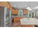 Modern kitchen offers stainless steel appliances, granite counters, and a central island at 7929 Pine Timber Dr, Raleigh, NC 27613