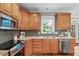 Gourmet kitchen features a gray backsplash, granite countertops and stainless steel appliances at 7929 Pine Timber Dr, Raleigh, NC 27613