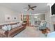 Cozy living room features a brick fireplace, soft natural light, and luxury seating at 7929 Pine Timber Dr, Raleigh, NC 27613